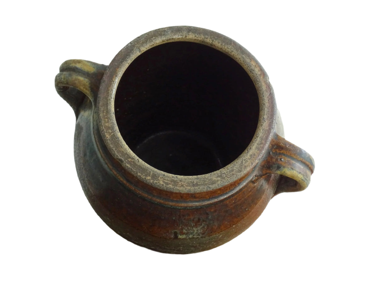 French antique earthenware vessel or confit pot in shades of brown with two handles