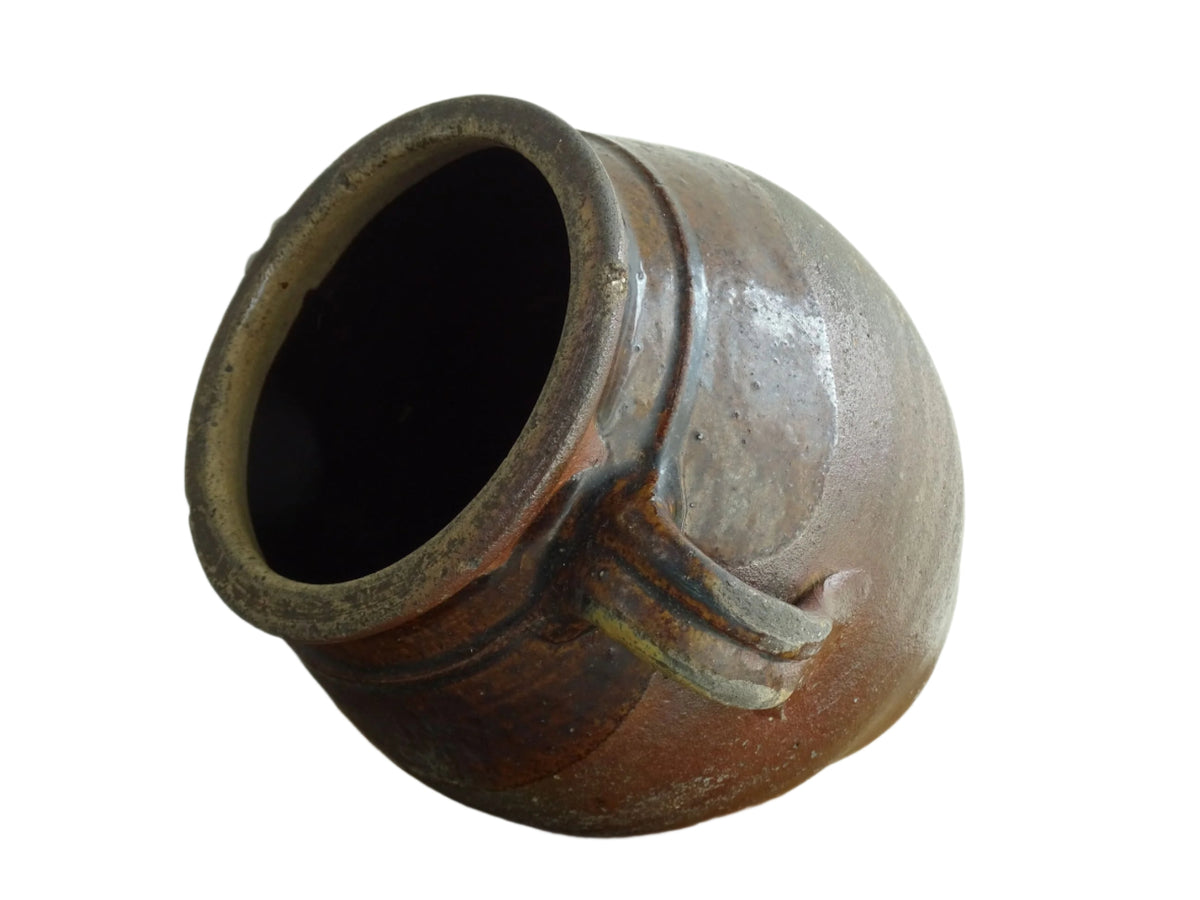 French antique earthenware vessel or confit pot in shades of brown with two handles