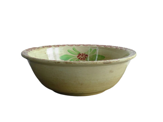 French antique ceramic salad bowl from Saint Amand. Hand-painted with a figure and decorated with leaves and flowers