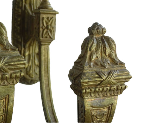 Large pair of French antique curtain hooks in gilt bronze with intricate detailing. Empire style hooks featuring intricate acanthus leaf motifs, acorn finials and architectural elements