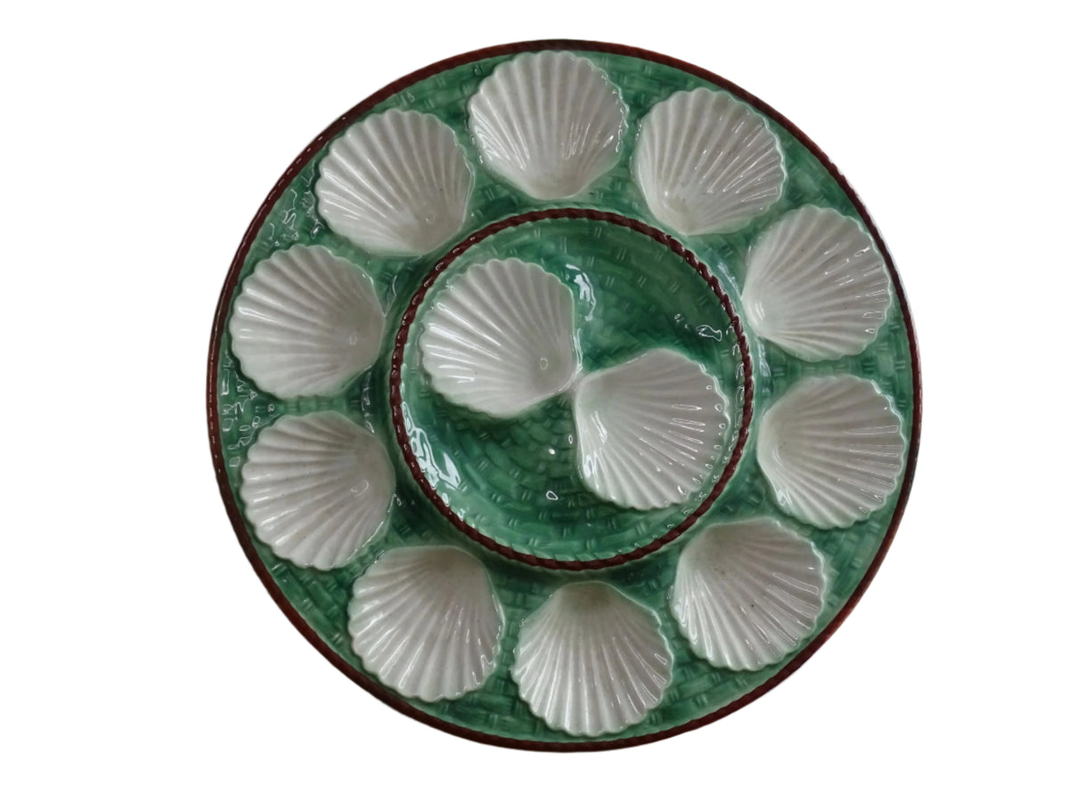 Vintage French barbotine oyster serving plate with space for twelve oysters, dating to around the 1930s. It has a green, basketweave design with a brown edge