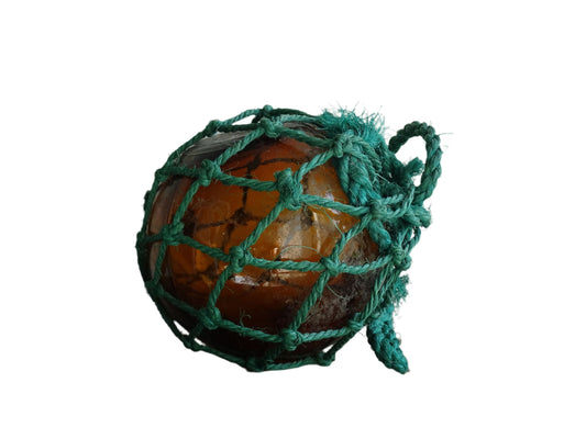 French vintage glass buoy in amber glass with green rope