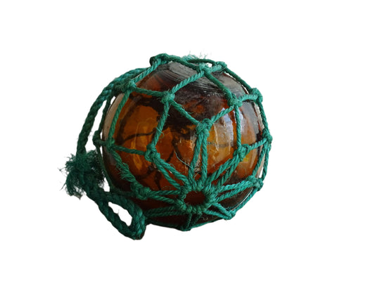 French vintage glass buoy in amber glass with green rope