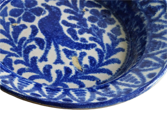 Spanish antique Fajalauza pottery bowl with blue hand-painted bird. Tin glazed earthenware bowl with a pink tone and decorated with deep blue hand-painted flowers, leaves and a bird which adorns the centre.