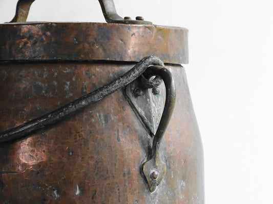 Large antique French copper cauldron with wrought iron handle, lid and rounded base. French farmhouse kitchen decor.