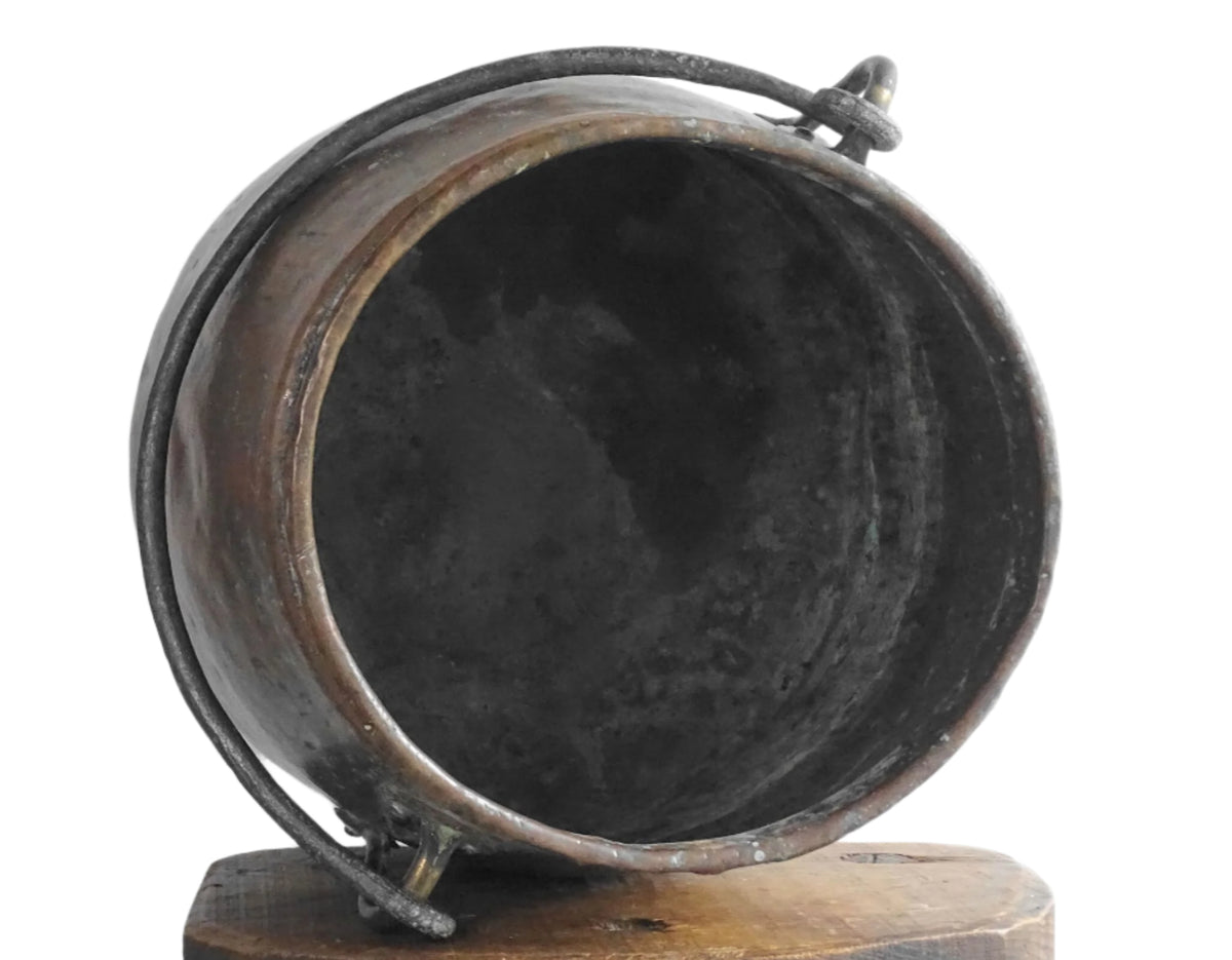 Large antique French copper cauldron with wrought iron handle, lid and rounded base. French farmhouse kitchen decor.