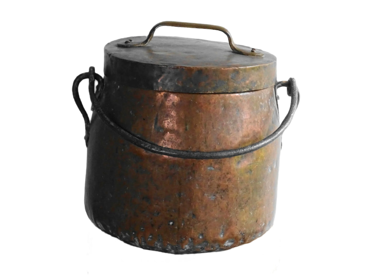Large antique French copper cauldron with wrought iron handle, lid and rounded base. French farmhouse kitchen decor.