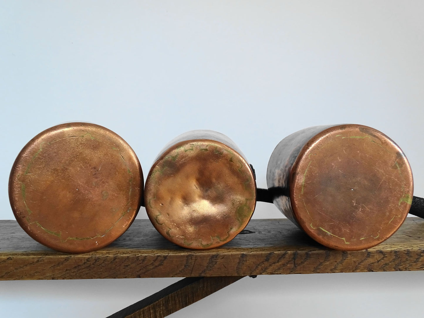 Set of three French antique copper saucepans, antique copper pans with patina