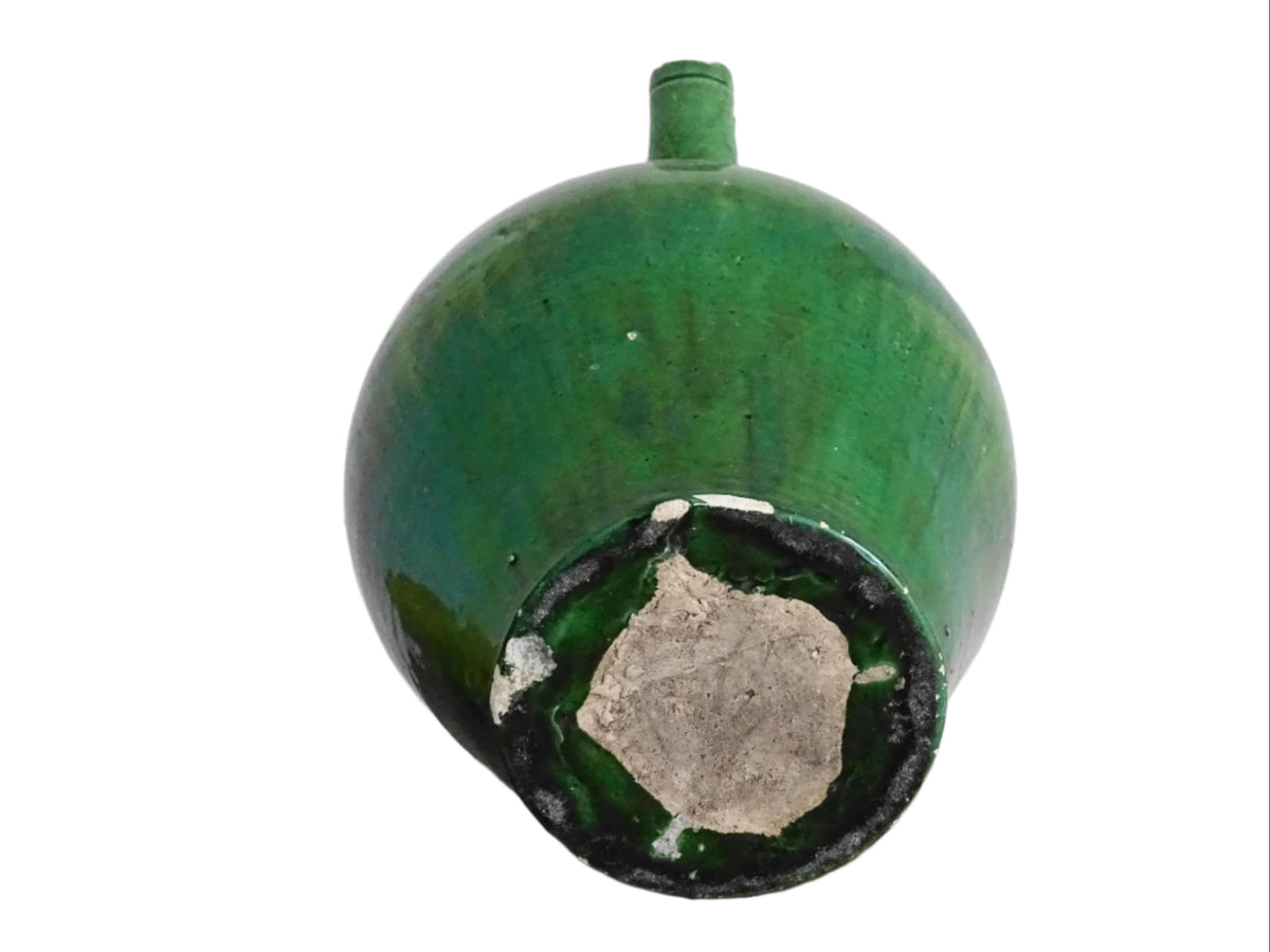 French antique gargoulette with green glaze from Provence. This antique Provençal water pitcher has a spout and two handles with a vivid green glaze. Pottery cruche.