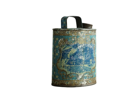 French antique Lourdes souvenir water flask in light blue, made from pewter, the top is decorated with stars, one side shows a view towards the cathedral (Sanctuaire de Notre-Dame de Lourdes), the other shows pilgrims in early 20th century dress attending mass at the Grotto of Massabielle. To the side is a depiction of the Virgin Mary. Flask for Lourdes holy water. Antique Lourdes souvenir religious decor.