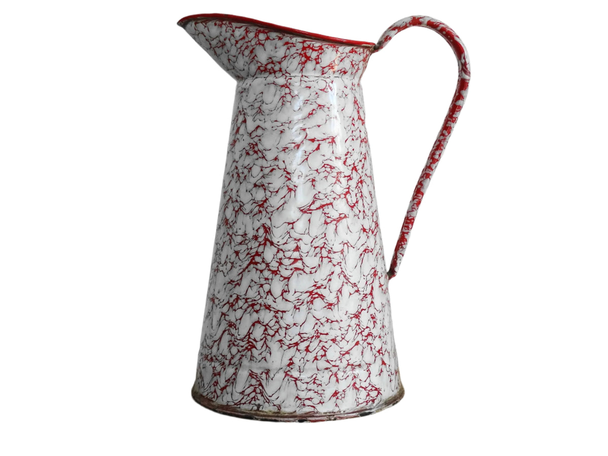 Large French vintage red and white enamelware pitcher with a large handle and spout. Tall enamel jug for farmhouse table