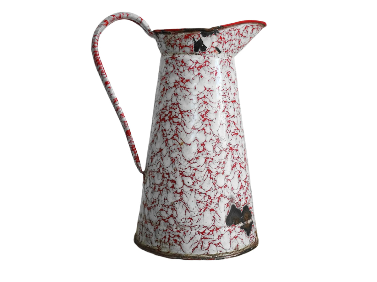 Large French vintage red and white enamelware pitcher with a large handle and spout. Tall enamel jug for farmhouse table