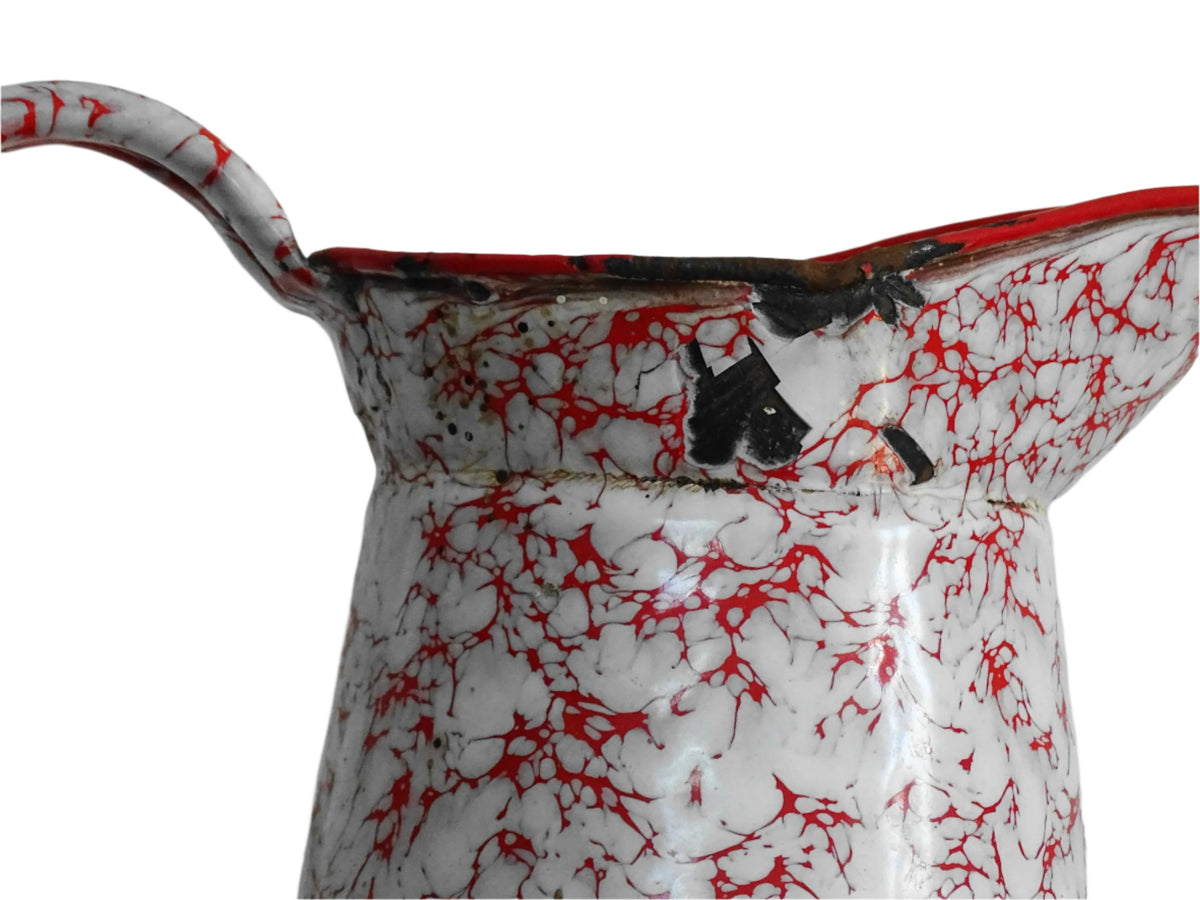 Large French vintage red and white enamelware pitcher with a large handle and spout. Tall enamel jug for farmhouse table