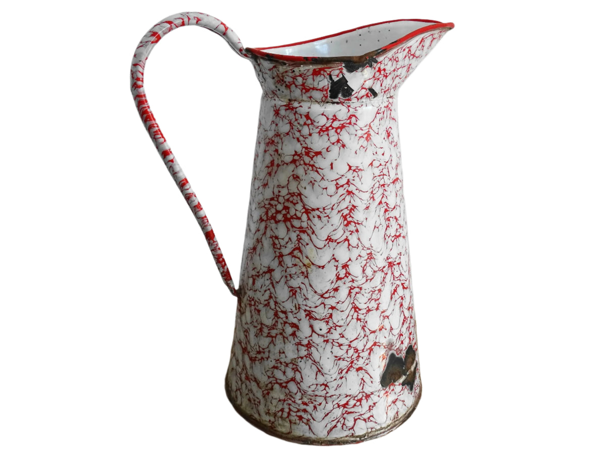 Large French vintage red and white enamelware pitcher with a large handle and spout. Tall enamel jug for farmhouse table