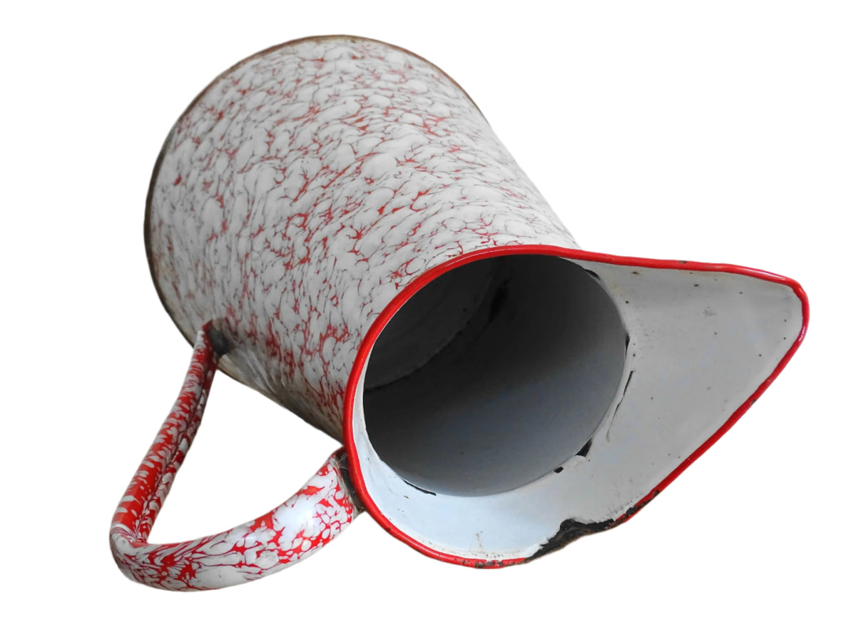 Large French vintage red and white enamelware pitcher with a large handle and spout. Tall enamel jug for farmhouse table