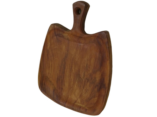 Vintage wooden cutting board with a handle on a white wooden background