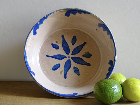 Spanish antique Fajalauza ceramic lebrillo from Granada. Terracotta ottery bowl with a pink tone and hand-painted blue star-shaped flower. Deep bowl for antique wall. Antique Mediterranean decor, decorative bowl.