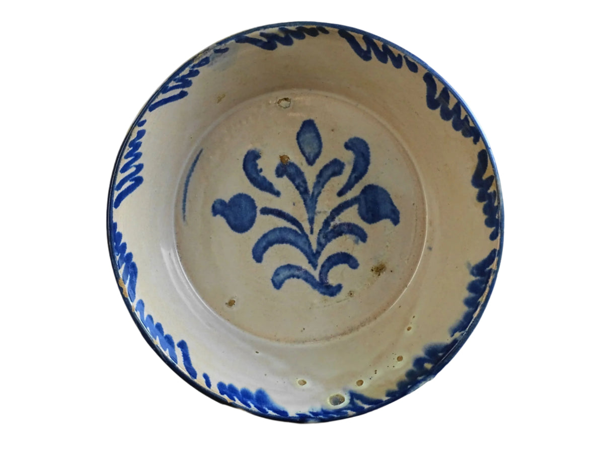 Spanish antique Fajalauza pottery lebrillo from Granada. Tin glazed terracotta bowl, hand-painted with blue leaves and flowers.
