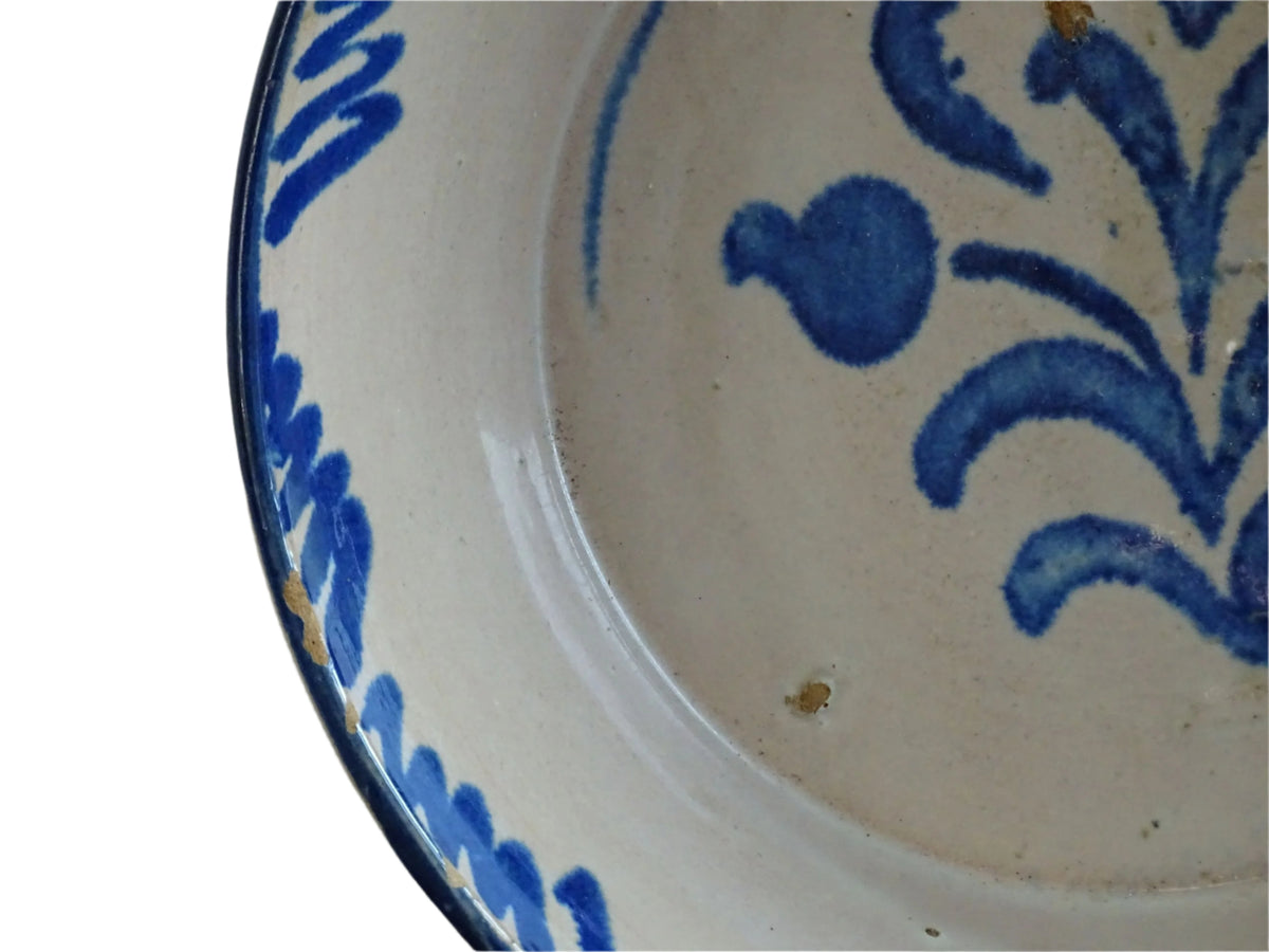 Spanish antique Fajalauza pottery lebrillo from Granada. Tin glazed terracotta bowl, hand-painted with blue leaves and flowers.