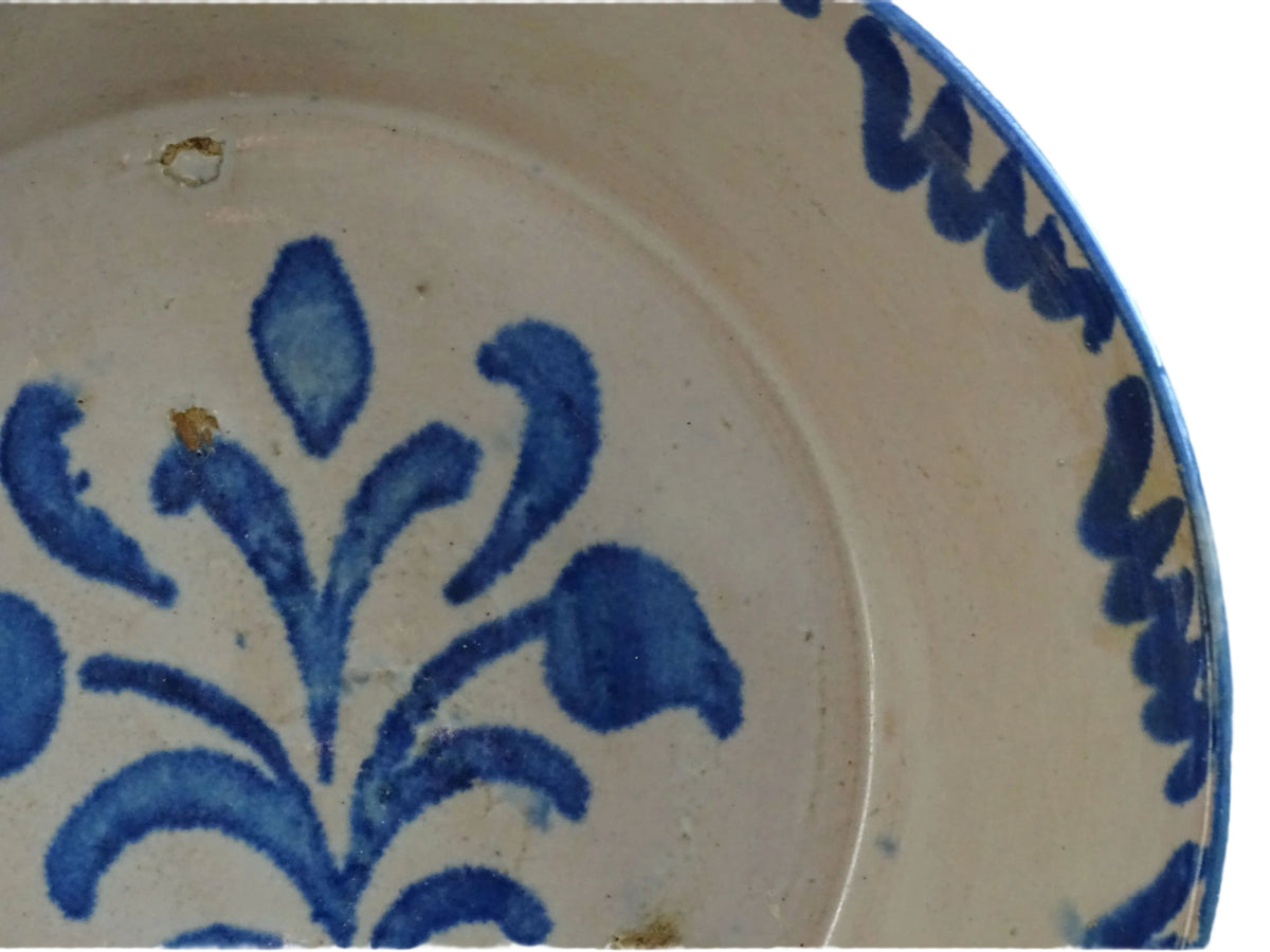 Spanish antique Fajalauza pottery lebrillo from Granada. Tin glazed terracotta bowl, hand-painted with blue leaves and flowers.