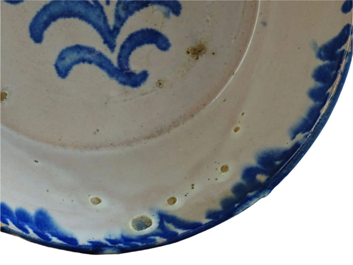 Spanish antique Fajalauza pottery lebrillo from Granada. Tin glazed terracotta bowl, hand-painted with blue leaves and flowers.