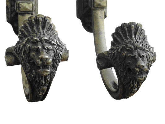 French antique curtain tie backs with lion heads. Decorative curtain hooks.