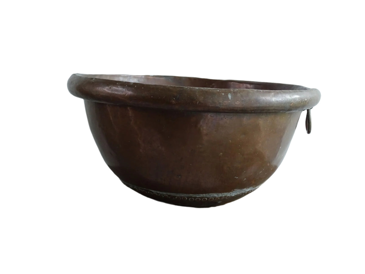 French Antique Copper Bowl for Confectioners 18th C. This timeworn copper mixing bowl has a rolled top and copper rivets to the curved base.