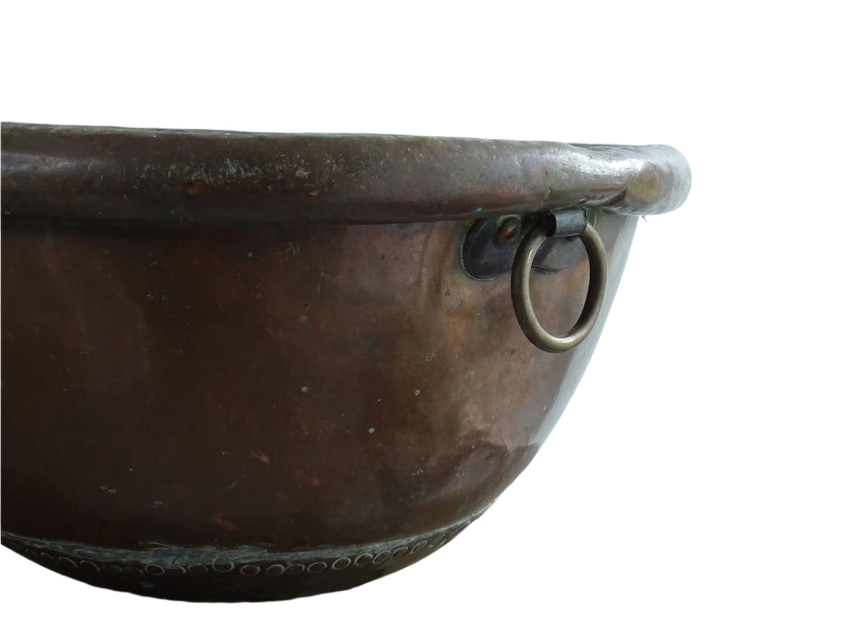 French Antique Copper Bowl for Confectioners 18th C. This timeworn copper mixing bowl has a rolled top and copper rivets to the curved base.
