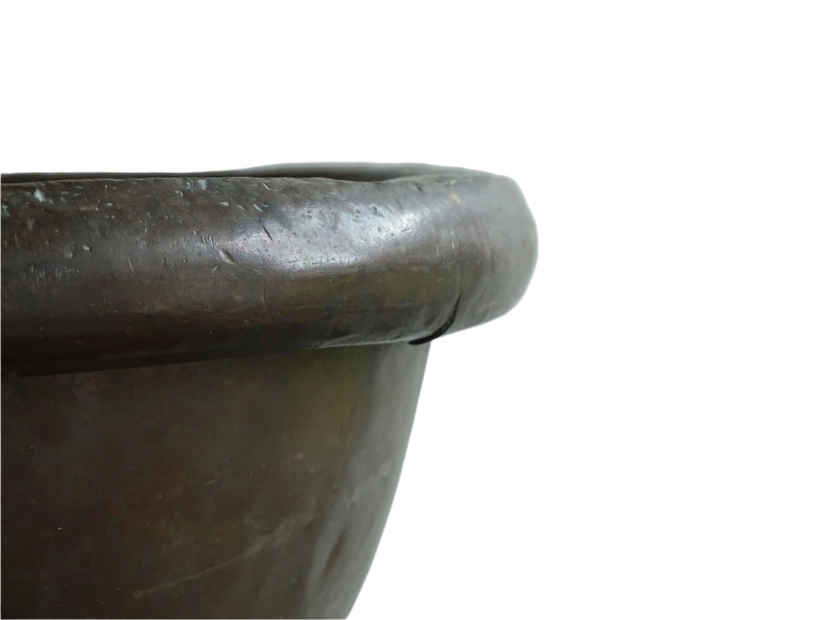 French Antique Copper Bowl for Confectioners 18th C. This timeworn copper mixing bowl has a rolled top and copper rivets to the curved base.
