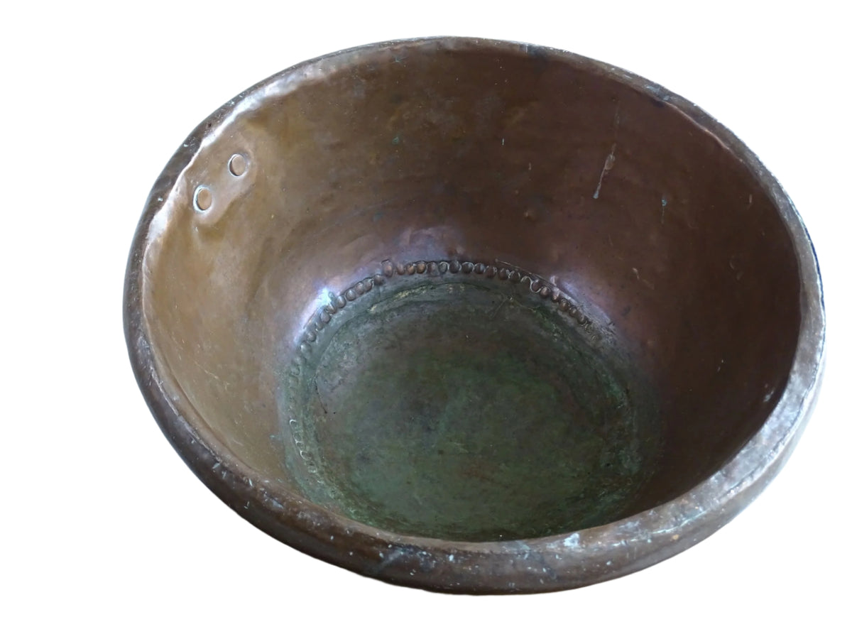 French Antique Copper Bowl for Confectioners 18th C. This timeworn copper mixing bowl has a rolled top and copper rivets to the curved base.
