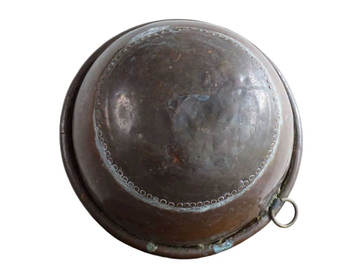 French Antique Copper Bowl for Confectioners 18th C. This timeworn copper mixing bowl has a rolled top and copper rivets to the curved base.