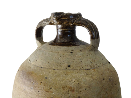 French antique pottery pitcher for a rustic farmhouse kitchen. Earthenware pottery pitcher with brown top, two handles and red-tone body