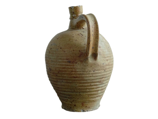 Rustic French antique pottery pitcher with orange and natural tones. Antique pitcher with rich texture for a rustic farmhouse kitchen.