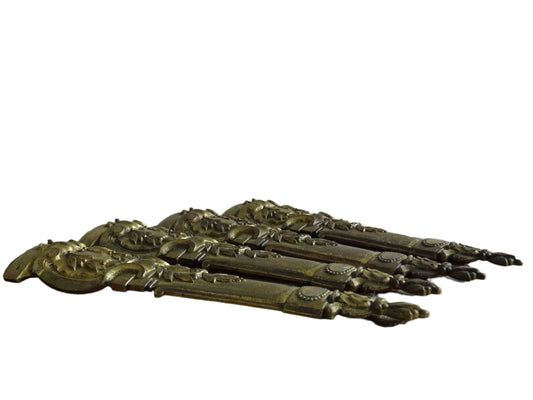 Set of four French antique furniture pediments in gilt bronze adorned with leaves and scrolls. Furniture leg pediments. Ormolu furniture embellishments.