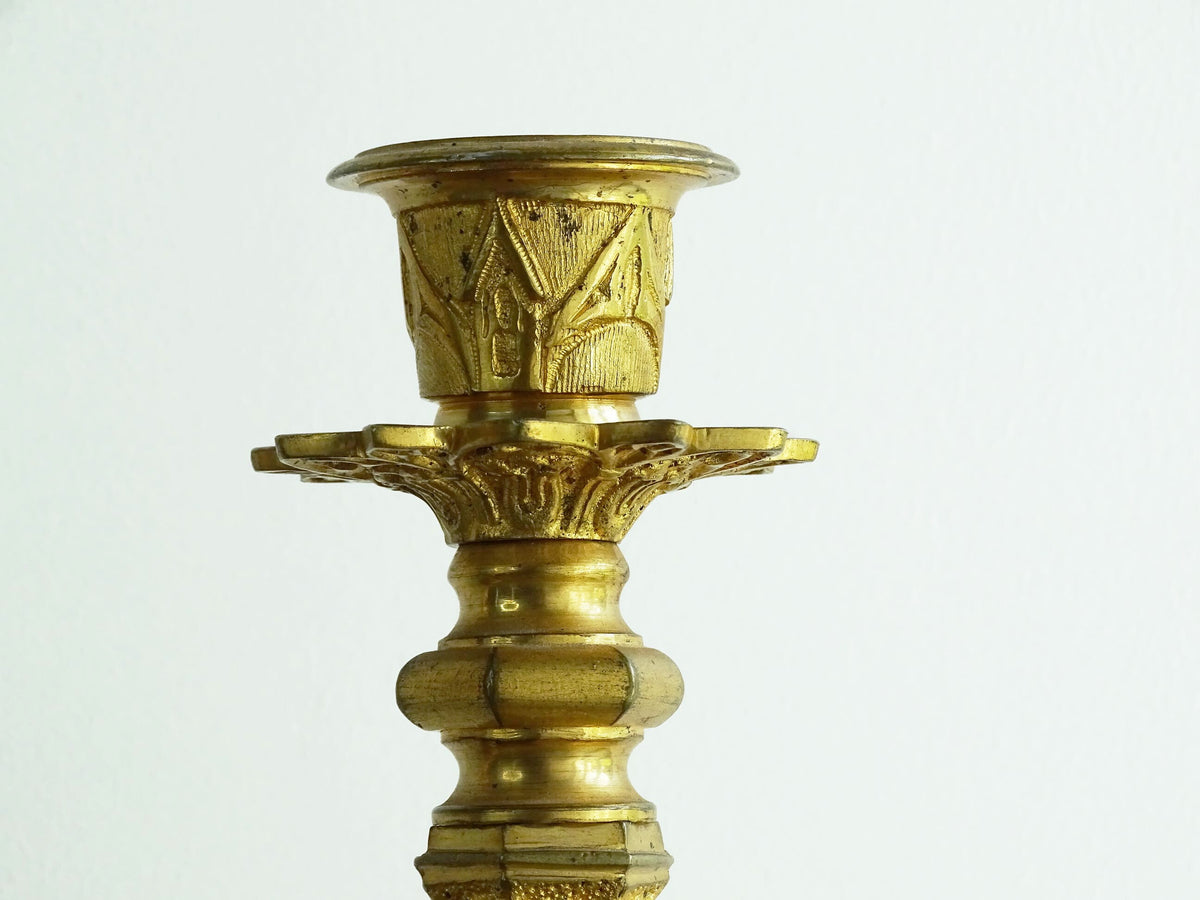 Antique French Ormolu Candlesticks from the 19th century, these antique candlesticks add a touch of French decor to your home.