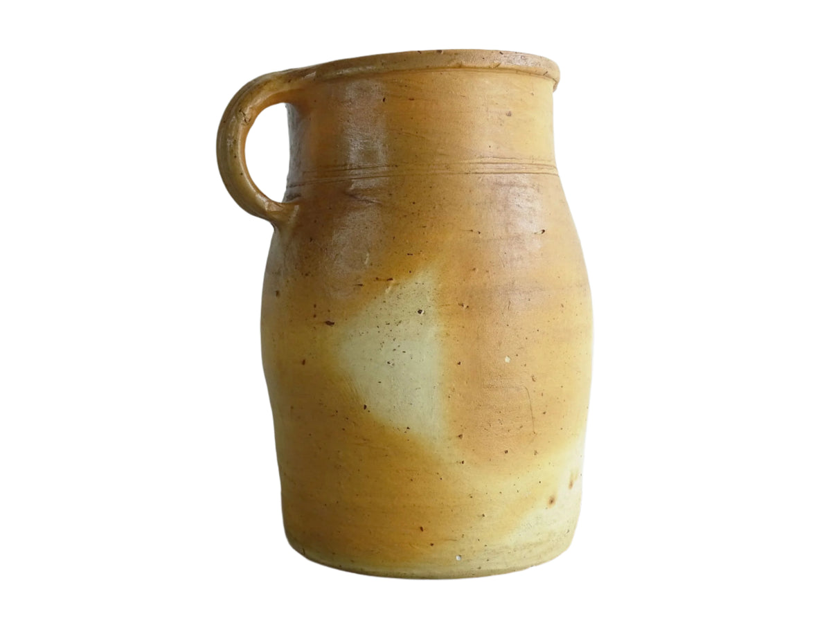 French antique pottery milk jug with orange tones for rustic farmhouse decor.