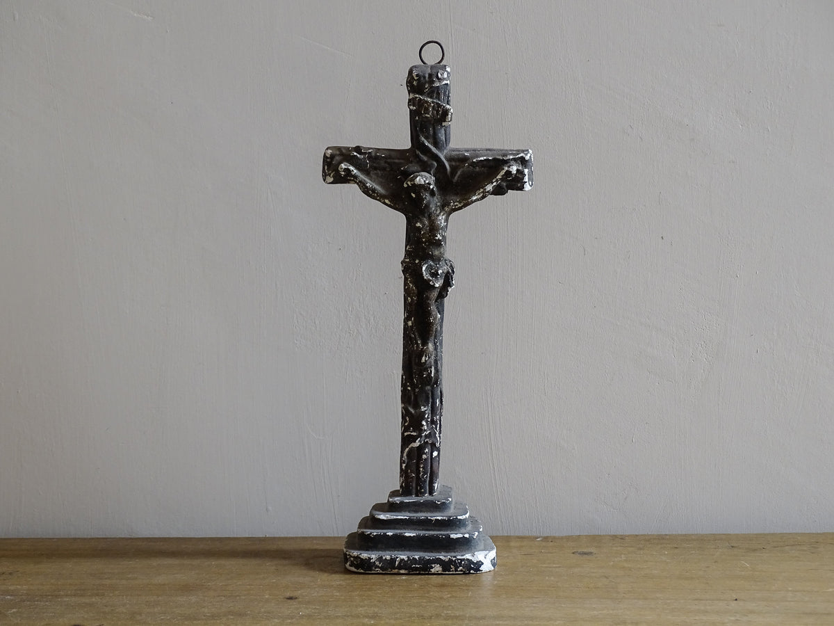 Timeworn French antique altar cross in plaster with a hook on the top so it. Antique altar crucifix as religious decor.