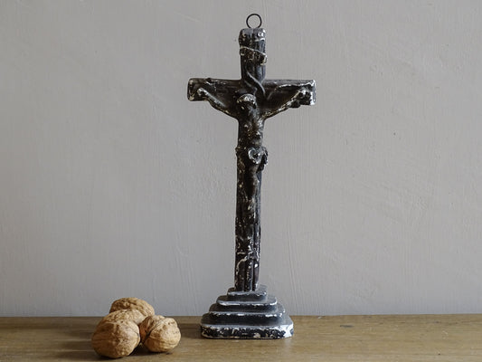 Timeworn French antique altar cross in plaster with a hook on the top so it. Antique altar crucifix as religious decor.