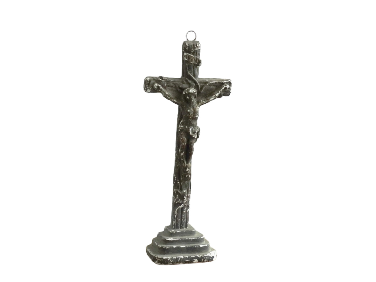 Timeworn French antique altar cross in plaster with a hook on the top so it. Antique altar crucifix as religious decor.