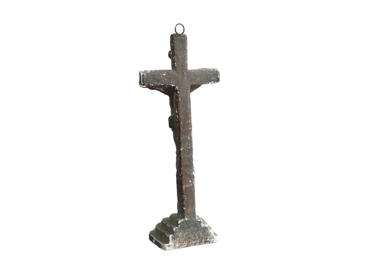 Timeworn French antique altar cross in plaster with a hook on the top so it. Antique altar crucifix as religious decor.