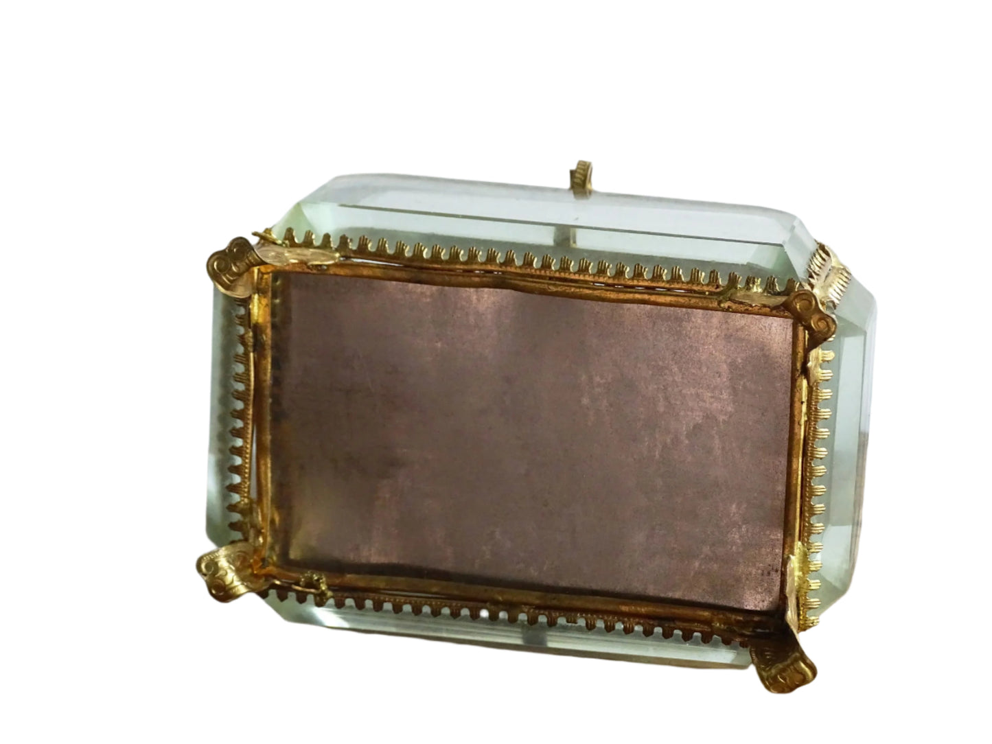 French antique glass jewelry box with bevelled glass. Antique trinket box with a pale blue silk covered cushion. Decorative gilt metal surrounds the thick, bevelled glass panels.