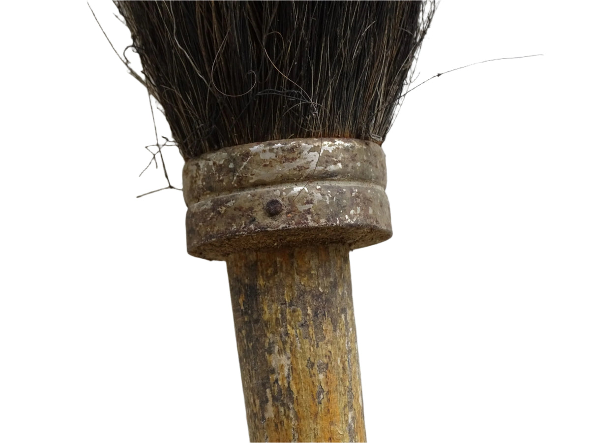 French antique paint brush with horse hair bristles and a patinated wooden handle. Art studio decor.