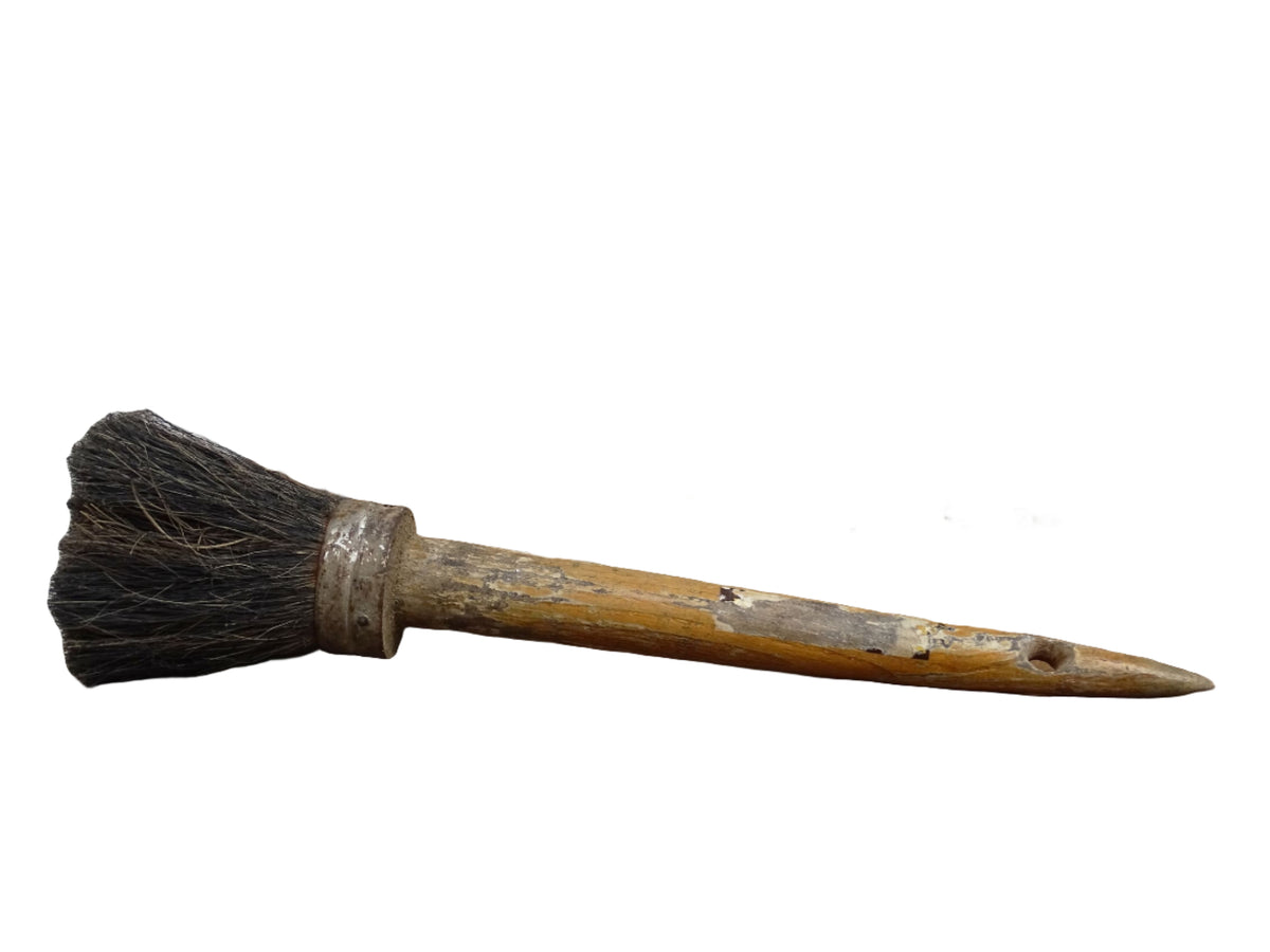 French antique paint brush with horse hair bristles and a patinated wooden handle. Art studio decor.