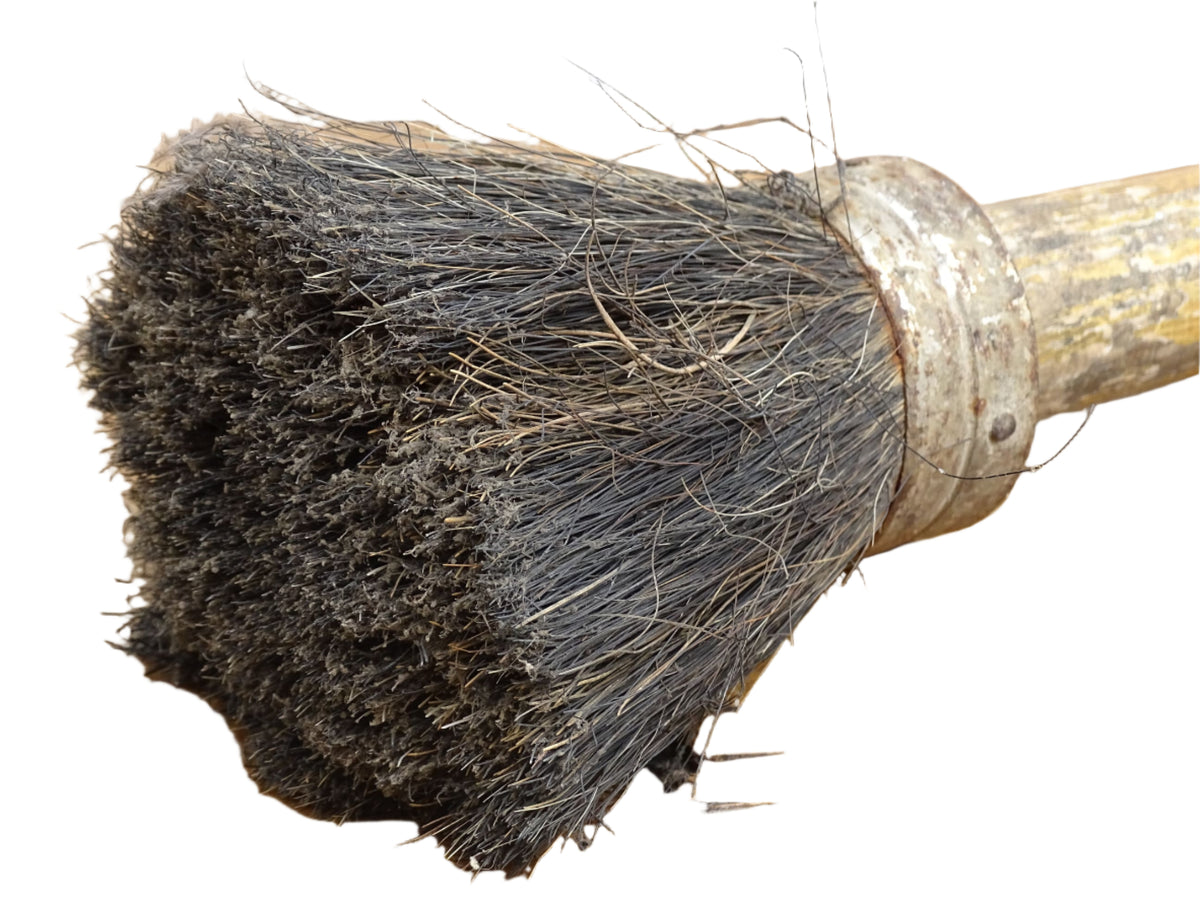French antique paint brush with horse hair bristles and a patinated wooden handle. Art studio decor.