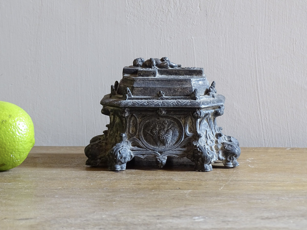 French antique pewter inkwell with religious decoration, it has a Cross and Sleeping Baby Jesus and Sacred Heart of Jesus Symbol