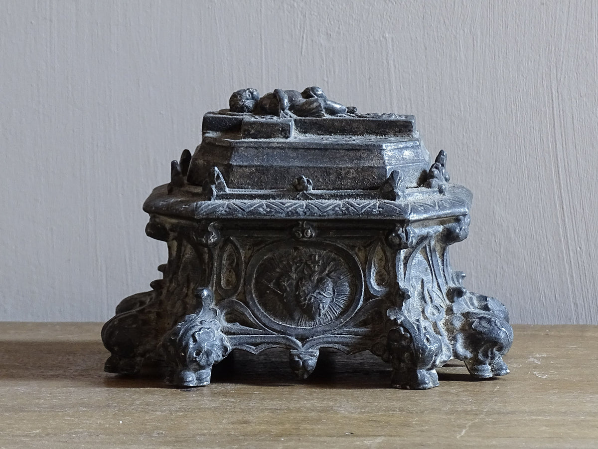 French antique pewter inkwell with religious decoration, it has a Cross and Sleeping Baby Jesus and Sacred Heart of Jesus Symbol