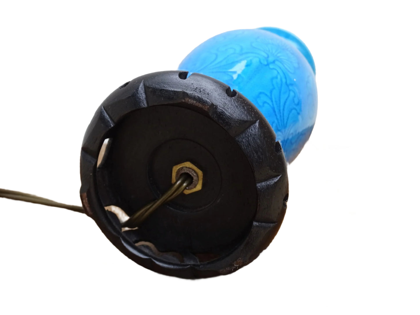 A Chinese antique porcelain table lamp in peacock blue with a raised flower and foliage design, set on a carved wooden base. Ideal for antique lamp collectors, bedroom decor, or as a vintage statement piece for living room interiors.