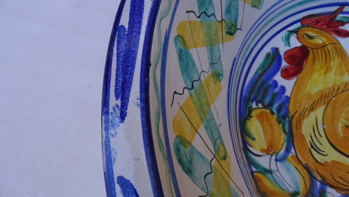 Large Vintage Spanish Triana Pottery Lebrillo with Hand-painted Cockerel Motif in Blue, Green, Yellow and Red. Tin glazed earthenware bowl.
