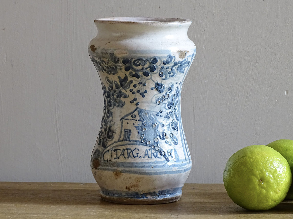 Italian albarello medicine jar from the 18th century, a tin-glazed, blue and white earthenware jar hand-painted with flowers, foliage and a naive house, dated 1763