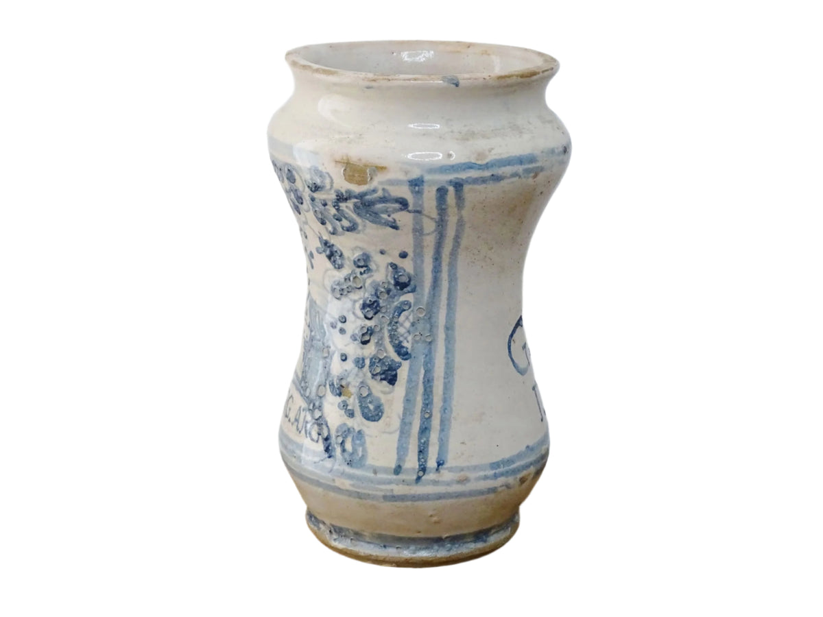 Italian albarello medicine jar from the 18th century, a tin-glazed, blue and white earthenware jar hand-painted with flowers, foliage and a naive house, dated 1763